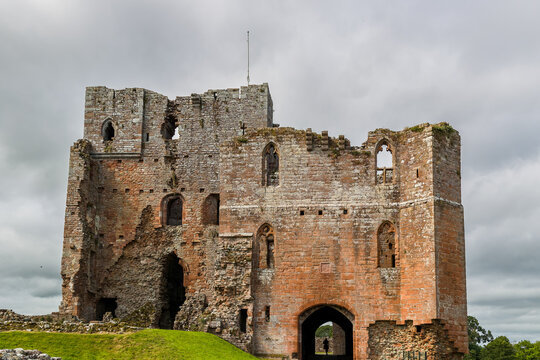 Ancient English heritage site showing medieval ruins of Brougham Castle on a cloudy day