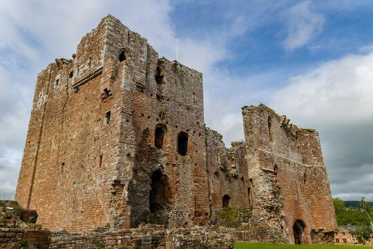 Low angle view of historic Brougham Castle, a medieval fortress ruin in England.