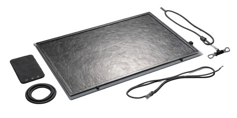 Flat rectangular display with accessories.  Grey textured screen, several cables, and a small box.  Surrounding components suggest a portable, self-contained device