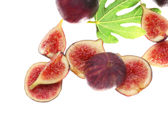 Flying fresh ripe figs and leaf on white background