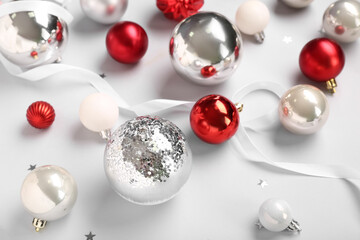 Christmas balls with ribbon on white background