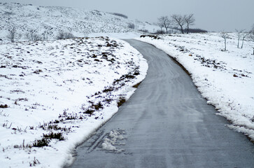 The danger and beauty of driving on a slippery winter road A Dangerous Path