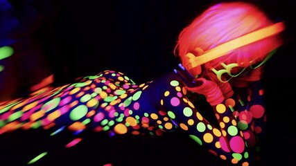 industrial complex with neon disco dancer overlayed on the wall