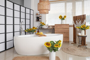 Bouquets of sunflowers in bathroom