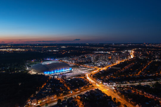 Poznań, Poland - August 2025: Aerial panoramic night view of illuminated city stadium (Stadion Miejski, ENEA Stadion), home for football club Lech Poznan KKS