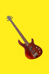 Modern electric guitar on yellow background