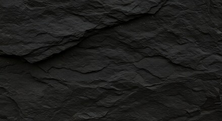 Striking textural black slate surface evoking raw earth and geological formations