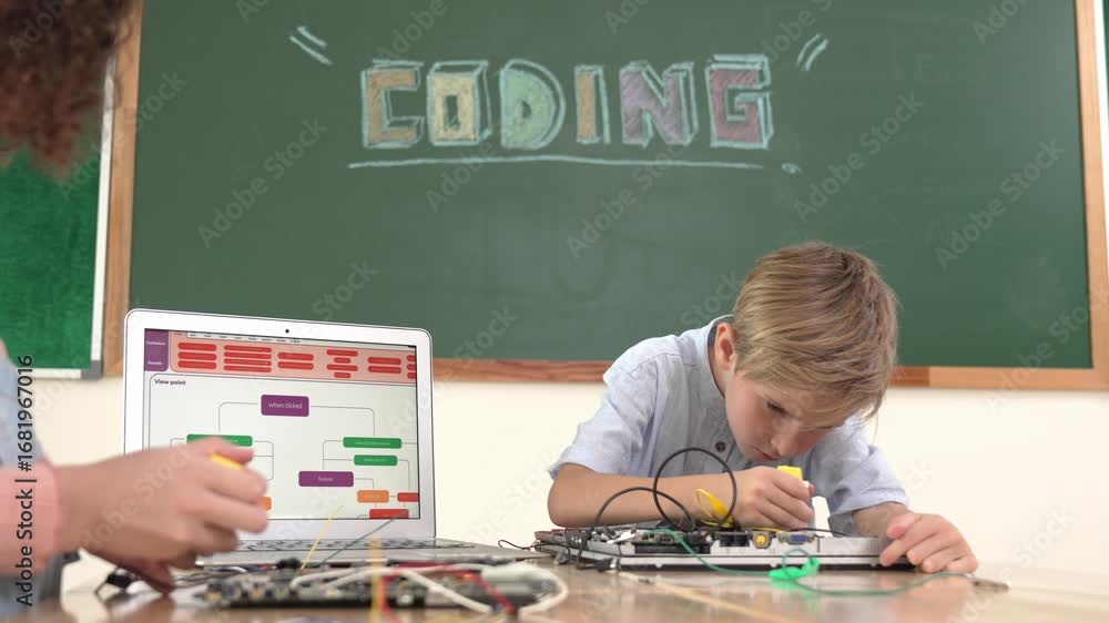 Poster caucasian smart boy fixing main board by using screwdriver at stem technology lesson while smiling s