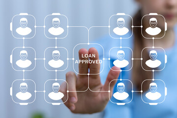 Young girl using virtual touch screen presses the inscription LOAN APPROVED. Loan approval business finance social problem concept.