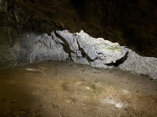 Cave Interior: Rock Formations and Dirt Floor