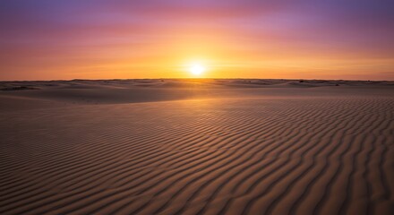 Fototapeta premium Vibrant sunset casting a purple and orange glow over the serene, wind-swept sand dunes of a vast, empty desert