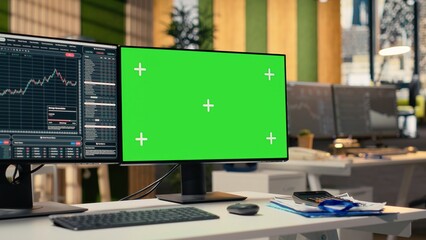Stock market metrics charts displayed on green screen computer display in investment firm office....