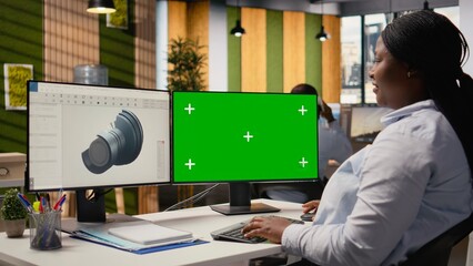 Wind energy researcher analyzes turbine component on green screen PC to maximize sustainability....