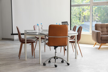 Interior of conference hall with table and projector screen