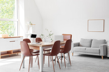 Interior of conference hall with table and sofa