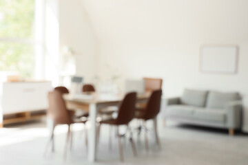 Blurred view of conference hall with table and sofa