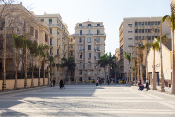 A general shot of a classic European-style plaza in Alexandria, capturing the blend of history and daily life under the Mediterranean sun
