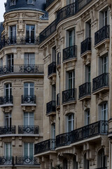 Paris Haussmann building with wrought iron balconies

