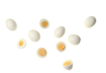 Flying boiled chicken eggs on white background