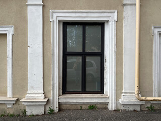 Building Exterior with White Pillars and Window
