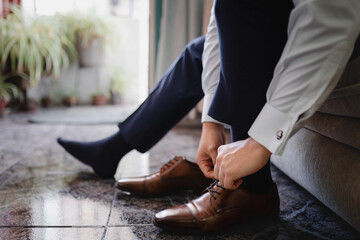 Man tying his rows of shoes