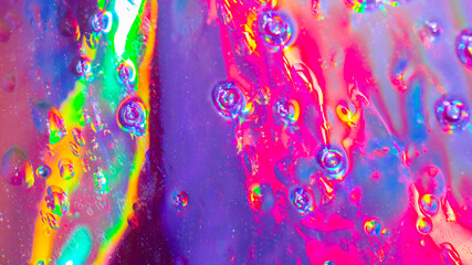 Abstract rainbow bokeh lights, colorful holographic blur on dark background, vibrant glowing texture