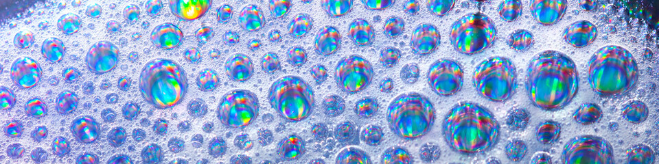 Abstract iridescent soap bubbles, colorful holographic foam texture, clean liquid bubble background