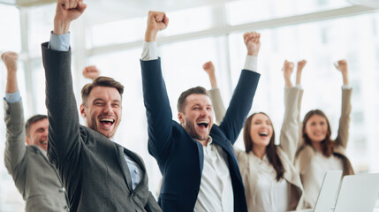 Celebrating success, group of professionals express joy and excitement in modern office setting. Their raised arms and smiles reflect teamwork and achievement, creating positive atmosphere