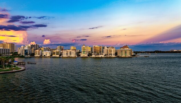 Waterfront skyline of Sarasota, Florida at sunset with colorful clouds