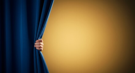 A hand pulls back a blue curtain, revealing a golden background. A symbol of unveiling or anticipation