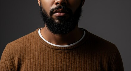 Fototapeta premium Close-up of Man with Beard Wearing Brown Sweater
