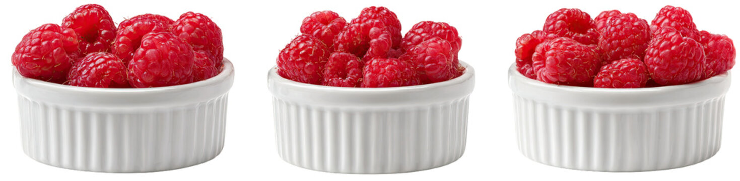 Three small white ramekins filled with fresh raspberries