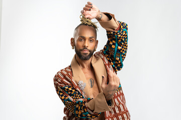Portrait Trendy black latin gay man in fashionable clothes dancing isolated on white background...