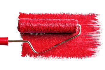 Red paint roller on a painted surface.  A red paint roller rests on a painted surface, showing red paint on both the roller and the surface. The metal handle and roller attachment are visible