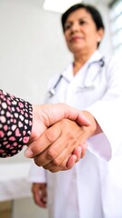 Doctor and patient shaking hands in a clinic
