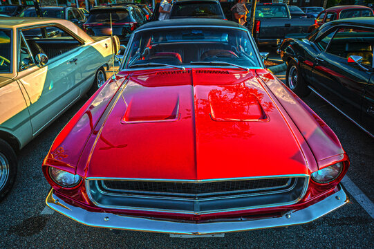 Vintage American muscle cars on display at show and shine.