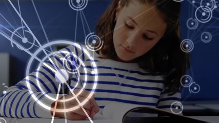 Schoolgirl opening notebook and writing notes in study area, with educational network overlay - Powered by Adobe