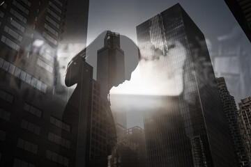 silhouette of a woman in the city face down feeling depressed, sadness, struggling with mental...