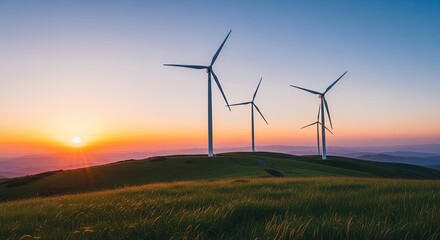 Obraz premium Sunset landscape with wind turbines generating clean energy