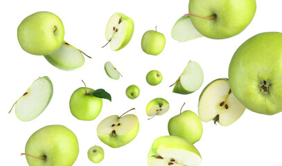 Fresh green apples swirling in air against white background