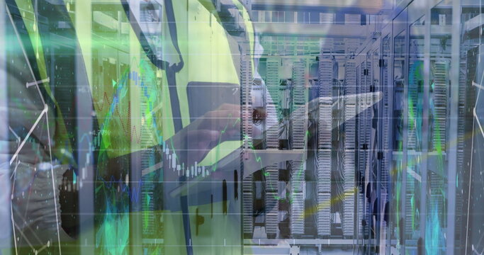 IT technician wearing reflective vest analyzing data on tablet at data center, with data charts - Powered by Adobe