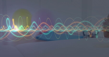 Displaying multicolored waveforms overlaying bedroom scene, with mattress pillow nightstand mug
