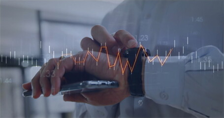 Tapping man in shirt interacting with smartwatch and smartphone in office showing financial chart