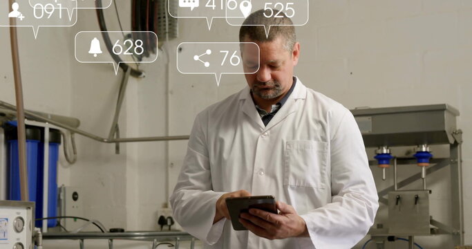 Lab coat technician using tablet in plant, with pipes, cables, notifications, blue filter housings - Powered by Adobe