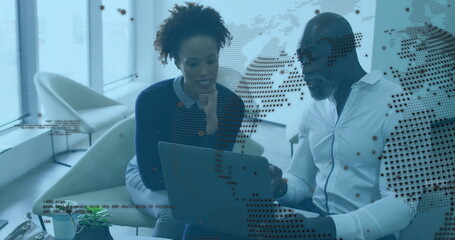 Collaborating professionals analyzing code overlays on laptop in office lounge with mug smartphone
