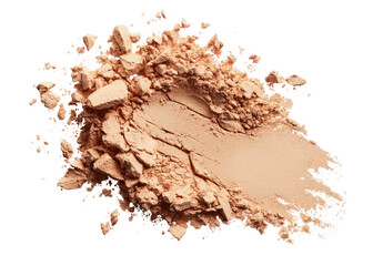 Crushed light beige powder makeup.  A swath of light beige powder, broken into fragments,  spreads across a black background
