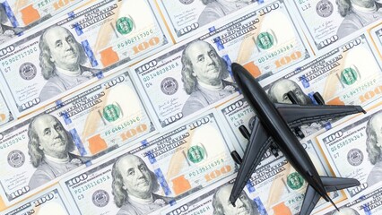 Travel Budget Concept Airplane Model on US Hundred Dollar Bills Background. Finance and Savings.