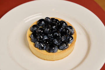 Savor the Delicious Blueberry Tart that features Fresh Berries for a delightful treat