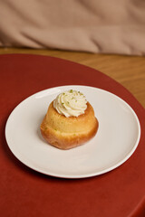 A Delicious and CreamTopped Dessert Beautifully Presented on a Plate for All to Enjoy