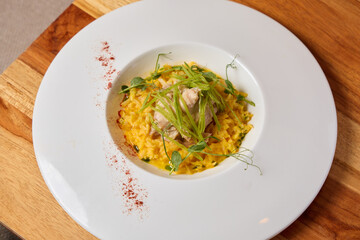 Indulge in a Delicious Gourmet Risotto complemented with Fresh Herbs and Tender Chicken